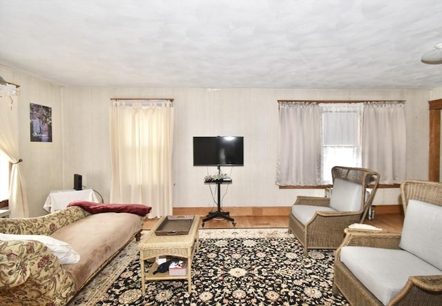 living room with wood finished floors and baseboards
