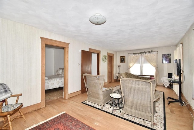 living room featuring baseboards and wood finished floors
