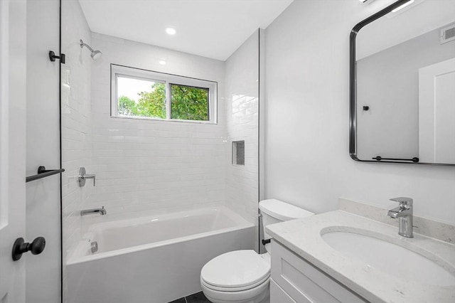 bathroom with toilet, shower / tub combination, and vanity