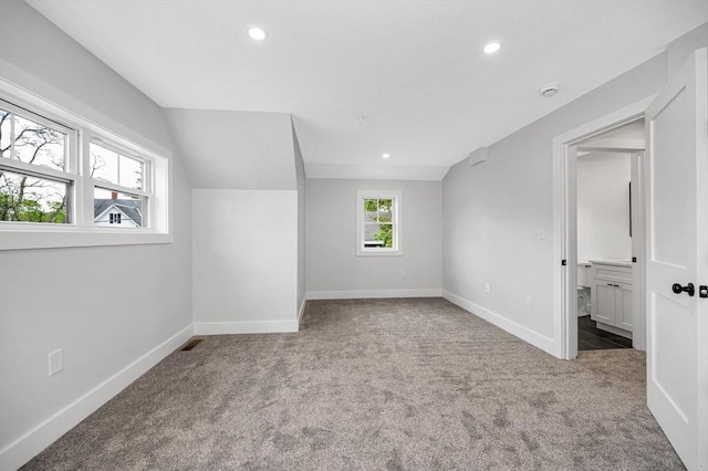 bonus room with carpet flooring, recessed lighting, and baseboards
