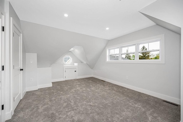 bonus room with lofted ceiling, carpet, recessed lighting, and baseboards