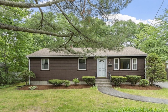 471 Lowell St, Reading, MA 01867 - view of front of house featuring a front lawn and a shingled roof