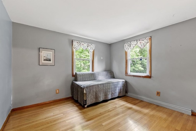 471 Lowell St, Reading, MA 01867 - bedroom with light wood-type flooring and baseboards