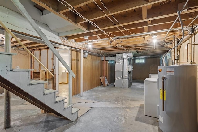 471 Lowell St, Reading, MA 01867 - basement featuring water heater, heating unit, stairway, and washer / dryer