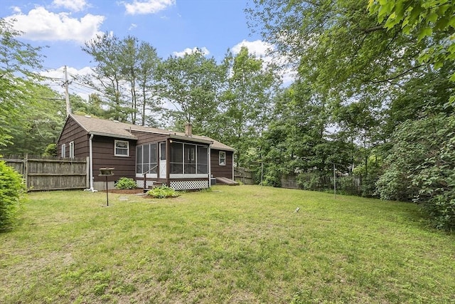 471 Lowell St, Reading, MA 01867 - fenced backyard with a sunroom