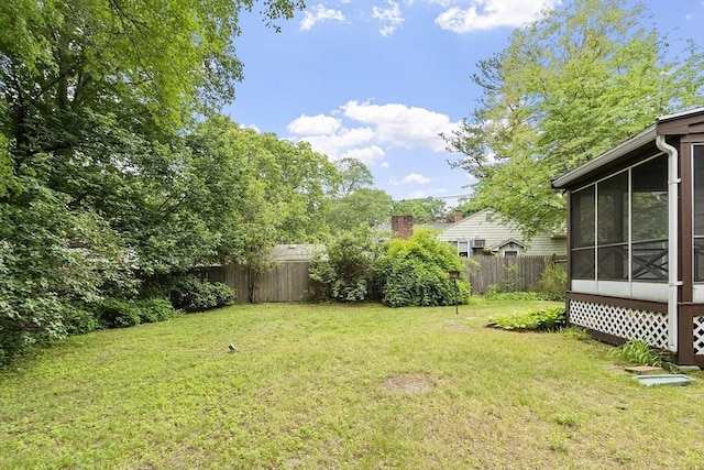 471 Lowell St, Reading, MA 01867 - fenced backyard featuring a sunroom