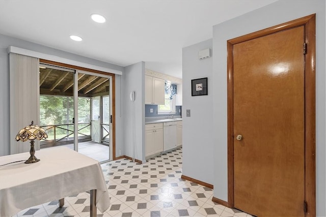471 Lowell St, Reading, MA 01867 - kitchen with dishwasher, light countertops, recessed lighting, and white cabinets