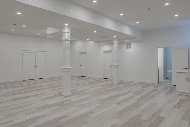 basement with light hardwood / wood-style floors