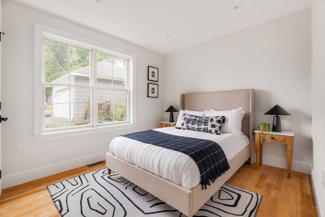 bedroom with light hardwood / wood-style floors