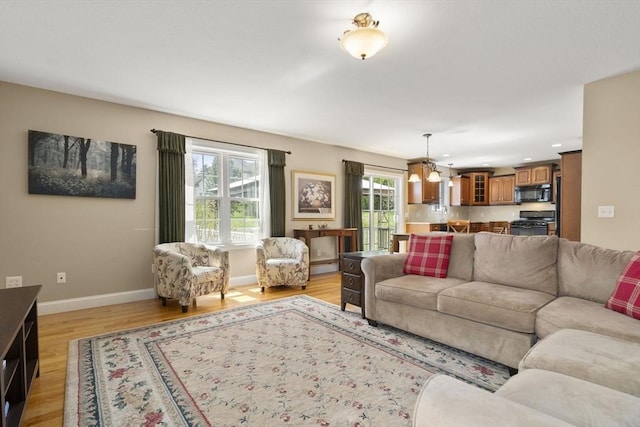 161 Bear Hole Rd, West Springfield, MA 01089 - living room with recessed lighting, baseboards, a chandelier, and light wood-style floors