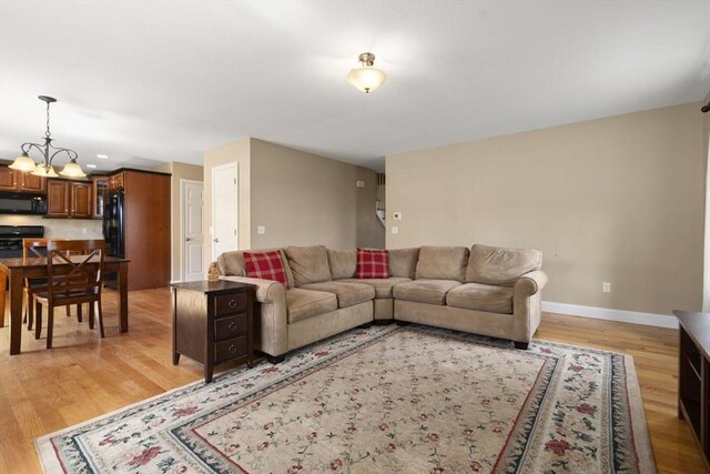 161 Bear Hole Rd, West Springfield, MA 01089 - living room featuring recessed lighting, baseboards, light wood finished floors, and a chandelier