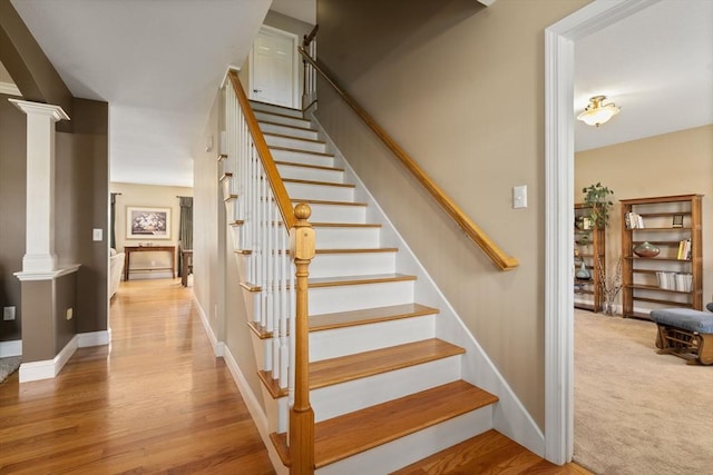 161 Bear Hole Rd, West Springfield, MA 01089 - staircase with baseboards, ornate columns, and wood finished floors