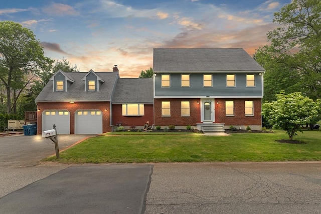 50 New Jersey Rd, Tewksbury, MA 01876 - colonial-style house with driveway, brick siding, a chimney, and a lawn