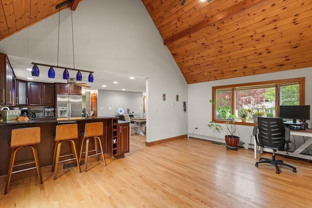 50 New Jersey Rd, Tewksbury, MA 01876 - kitchen with stainless steel fridge with ice dispenser, high vaulted ceiling, dark countertops, light wood-style floors, and a breakfast bar