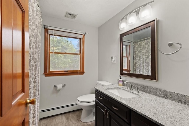 50 New Jersey Rd, Tewksbury, MA 01876 - full bathroom with a baseboard heating unit, vanity, toilet, a shower with curtain, and wood finished floors
