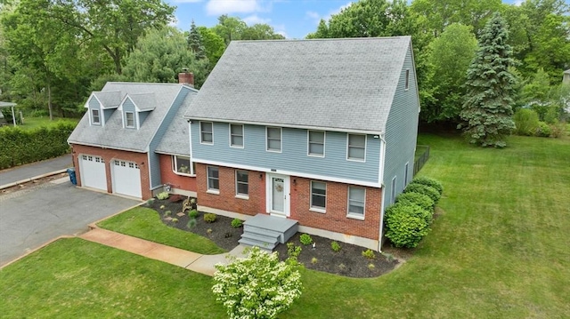 50 New Jersey Rd, Tewksbury, MA 01876 - view of front of house with driveway, a chimney, a garage, and a front lawn