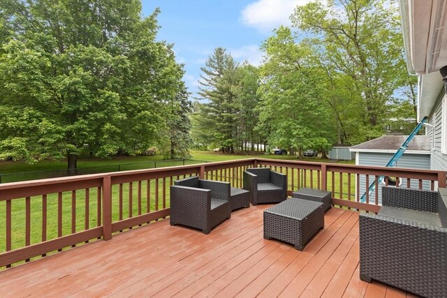 50 New Jersey Rd, Tewksbury, MA 01876 - deck with an outdoor living space and view of wooded area