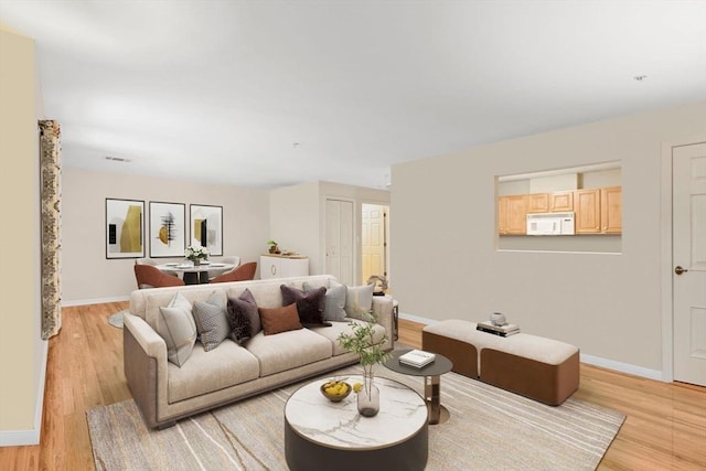 living room with light hardwood / wood-style floors