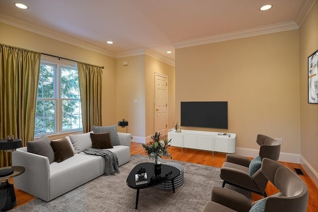 living room with hardwood / wood-style floors and ornamental molding