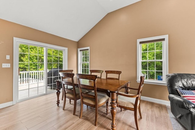 33 Beaver St, Whitman, MA 02382 - dining room featuring light wood-style floors, baseboards, and high vaulted ceiling