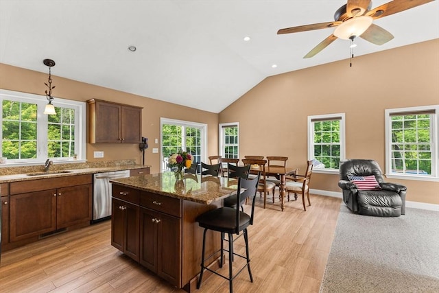 33 Beaver St, Whitman, MA 02382 - kitchen featuring dishwasher, a sink, a breakfast bar area, plenty of natural light, and recessed lighting