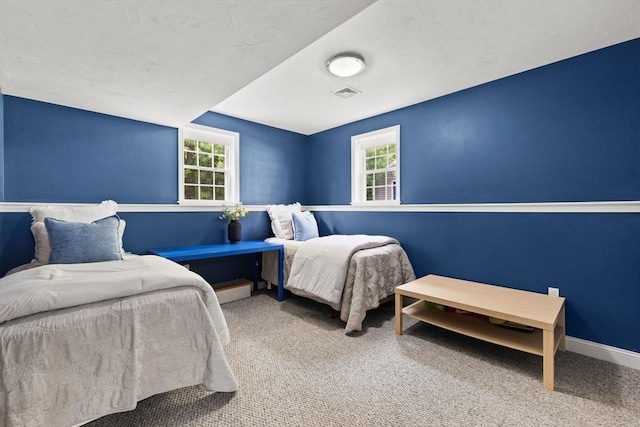 33 Beaver St, Whitman, MA 02382 - carpeted bedroom with multiple windows and baseboards