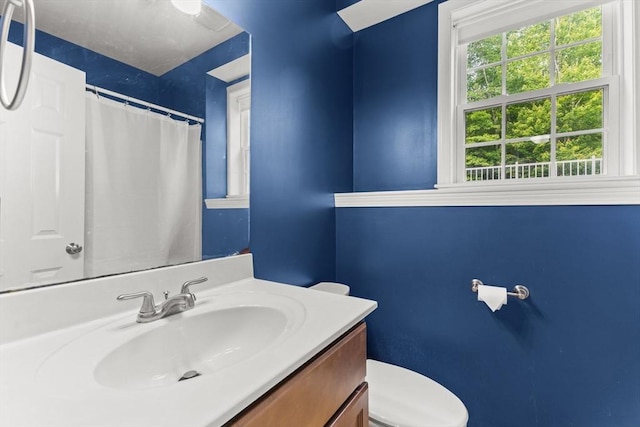 33 Beaver St, Whitman, MA 02382 - bathroom featuring vanity, toilet, and a shower with curtain