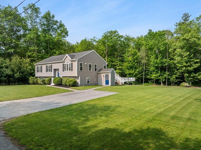 33 Beaver St, Whitman, MA 02382 - split foyer home with a front lawn and an outdoor structure