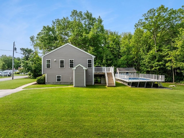 33 Beaver St, Whitman, MA 02382 - back of house featuring stairway, a wooden deck, an outdoor pool, and a yard
