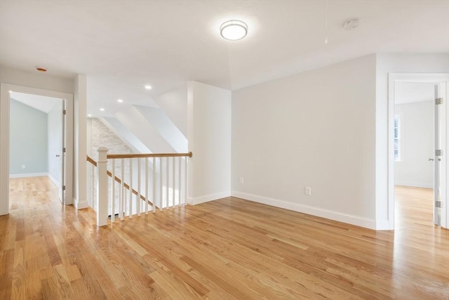 spare room featuring light hardwood / wood-style floors