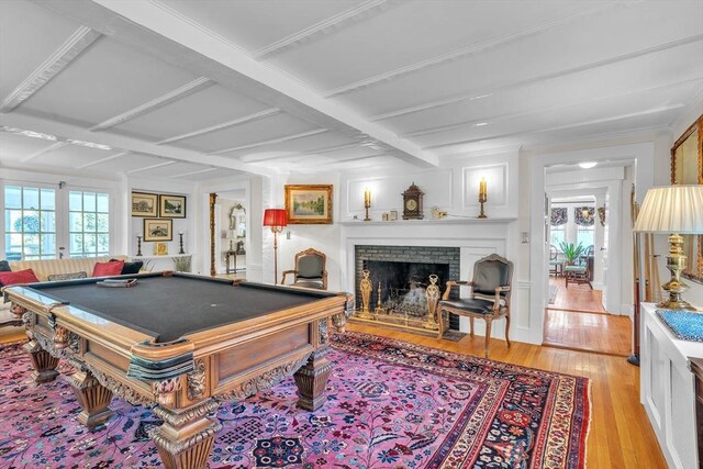 40 Pleasant St, Dover, MA 02030 - game room featuring a brick fireplace, beamed ceiling, billiards, and light wood-style floors