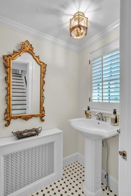 40 Pleasant St, Dover, MA 02030 - bathroom with radiator heating unit, baseboards, ornamental molding, and a sink
