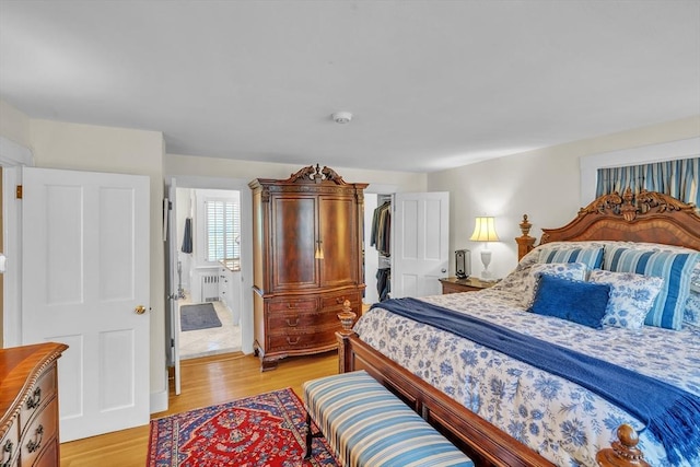 40 Pleasant St, Dover, MA 02030 - bedroom with light wood-style floors and radiator heating unit