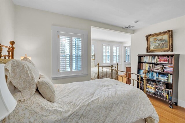 40 Pleasant St, Dover, MA 02030 - bedroom with baseboards, light wood-style flooring, and visible vents