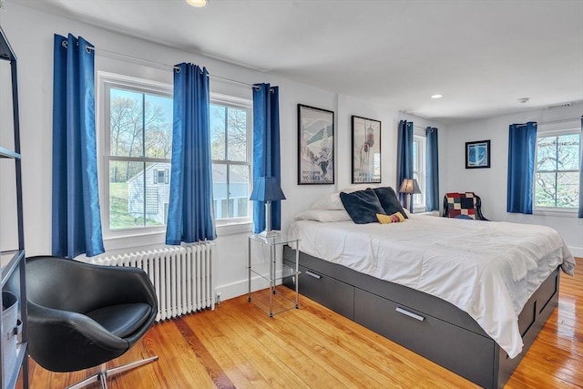 40 Pleasant St, Dover, MA 02030 - bedroom with visible vents, radiator, wood finished floors, baseboards, and recessed lighting