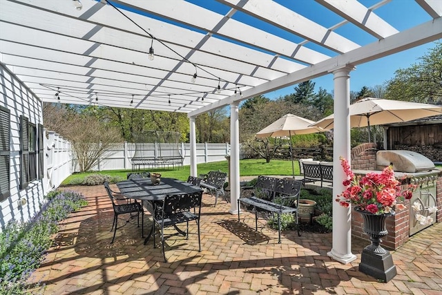 40 Pleasant St, Dover, MA 02030 - view of patio with outdoor dining space, a pergola, a trampoline, exterior kitchen, and a fenced backyard