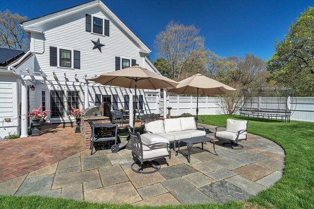 40 Pleasant St, Dover, MA 02030 - view of patio with a pergola, outdoor lounge area, a fenced backyard, and a trampoline