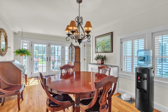 40 Pleasant St, Dover, MA 02030 - dining room featuring crown molding, a notable chandelier, french doors, light wood-style flooring, and baseboards