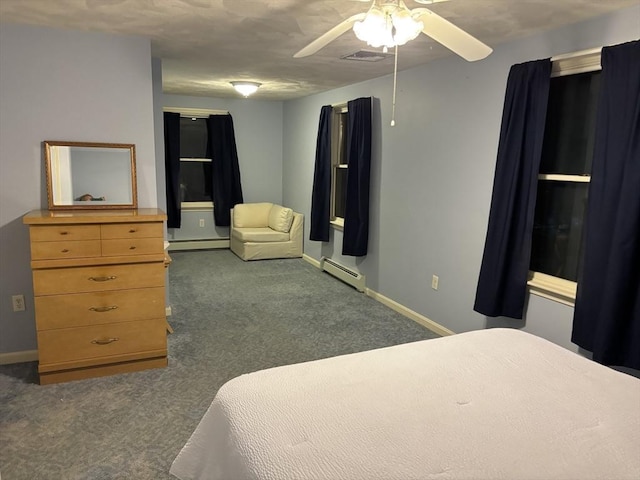 bedroom with carpet, a baseboard radiator, visible vents, and baseboards