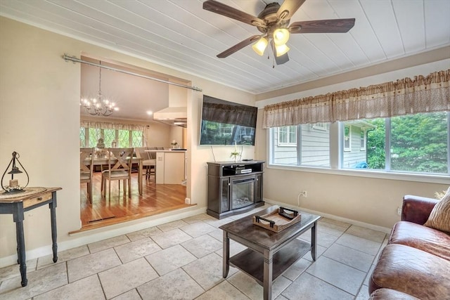 13 Tamarack Rd, Medfield, MA 02052 - living room featuring a chandelier, healthy amount of natural light, a ceiling fan, tile patterned flooring, and wood ceiling