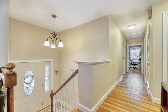 13 Tamarack Rd, Medfield, MA 02052 - foyer with light wood-style floors and a chandelier