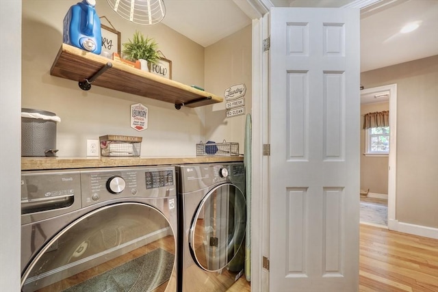 13 Tamarack Rd, Medfield, MA 02052 - laundry area featuring washing machine and dryer and light wood-style floors
