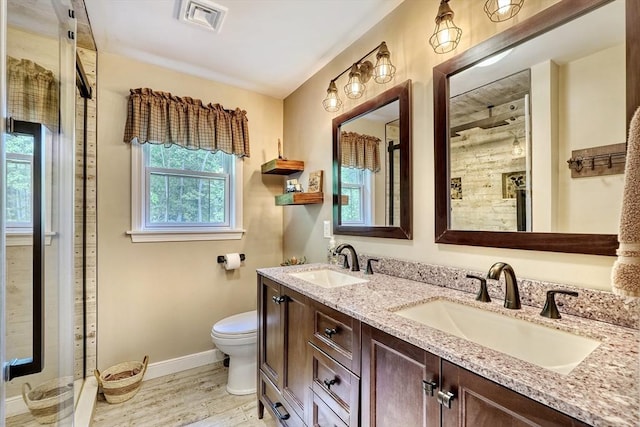 13 Tamarack Rd, Medfield, MA 02052 - full bathroom featuring double vanity, wood finished floors, and tiled shower