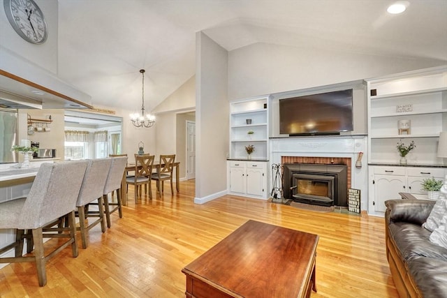 13 Tamarack Rd, Medfield, MA 02052 - living area with a chandelier, light wood-type flooring, and high vaulted ceiling