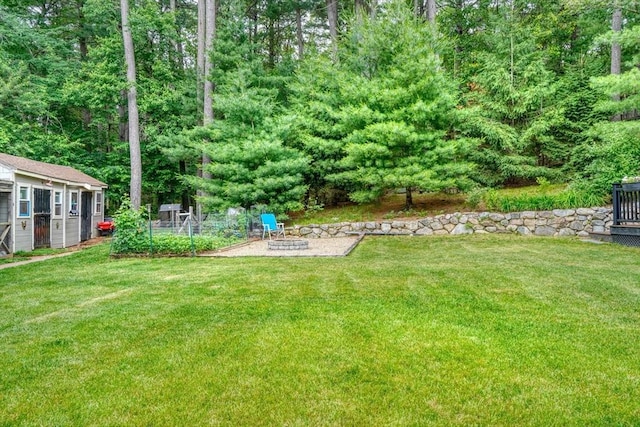 13 Tamarack Rd, Medfield, MA 02052 - view of grassy yard featuring an outdoor fire pit