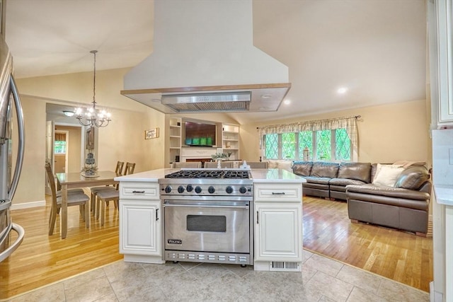 13 Tamarack Rd, Medfield, MA 02052 - kitchen with stainless steel appliances, custom exhaust hood, open floor plan, a chandelier, and white cabinetry