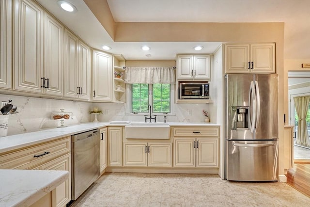13 Tamarack Rd, Medfield, MA 02052 - kitchen featuring stainless steel appliances, decorative backsplash, light stone countertops, recessed lighting, and open shelves