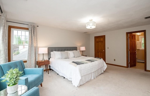 bedroom with baseboards, visible vents, light carpet, and baseboard heating