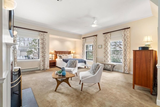 bedroom featuring a baseboard heating unit, ceiling fan, baseboards, and light colored carpet