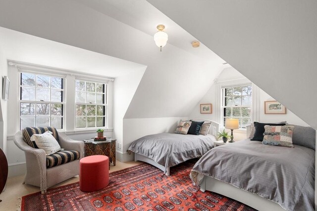 carpeted bedroom with vaulted ceiling